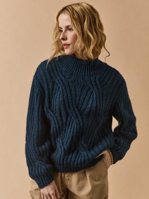 Women's cable knit sweater with high neckline